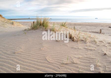 The sandy coastline at South Shields beach, a seaside town near Newcastle upon Tyne in the North East of England. Stock Photo