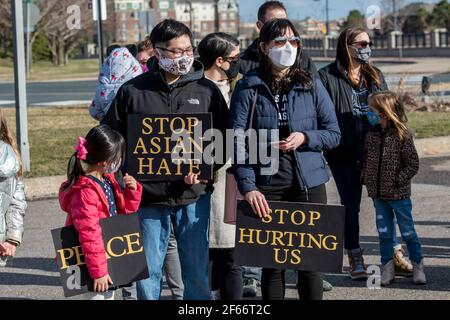 Maple Grove, Minnesota. March 25, 2021. An Asian family at a protest to stop Asian hate and to remember the victims of the Atlanta Killings. Stock Photo