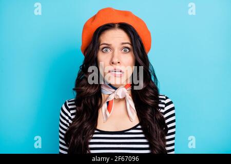 Photo of impressed wavy hairdo person teeth grinning staring camera isolated on blue color background Stock Photo