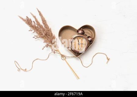 Gift cardboard heart box with antique watch Stock Photo