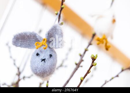Leipzig, Saxony, Germany, 03-23-03 self-made Easter decorations -knitted easter bunny- on a cherry branch Stock Photo