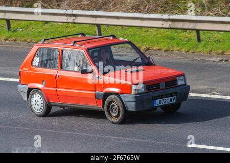 1993 90s nineties red Fiat Panda 1000 Clx Ie 999cc hatchback; Vehicular traffic, moving vehicles, cars, vehicle driving on UK roads, motors, motoring on the M6 highway English motorway road network Stock Photo