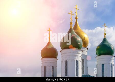 Russian Christian Orthodox church with domes and a cross against the sky. Russian Orthodoxy and Christian Faith concept. High quality photo Stock Photo