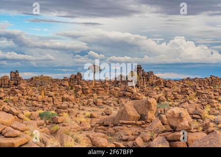 Massive Dolerite Rock Formations at Giant's Playground near Keetmanshoop, Namibia, Africa, background cloudy sky Stock Photo