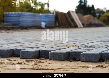 new pavement of paving slabs, new street being paved Stock Photo