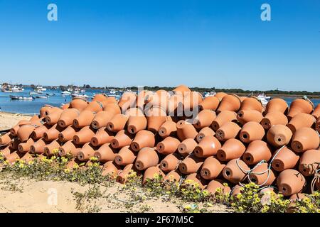 Traditional ceramic pots for catching octopus in Punta Umbria harbor, Huelva, Andalusia, Spain Stock Photo