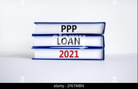 PPP, paycheck protection program loan 2021 symbol. Concept words PPP loan 2021 on books on a beautiful white background. Business, PPP - paycheck prot Stock Photo