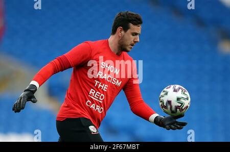 Wales goalkeeper Danny Ward warms up in a ‘Show Racism the Red Card’ t shirt during the 2022 FIFA World Cup Qualifying match at Cardiff City Stadium, Wales. Picture date: Tuesday March 30, 2021. Stock Photo