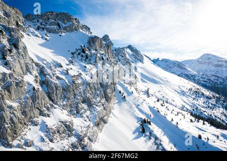 Aerial view of winter mountain landscape. Snow covered rugged rock massif, Vercors mountains, France. Stock Photo