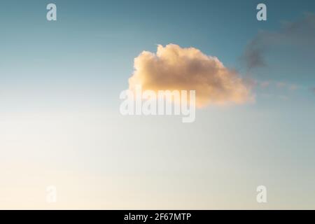 Blue sky and small fluffy single cloud Stock Photo