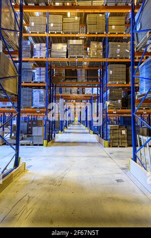 Forklift cross bridge aisle in racking system in modern distribution ...