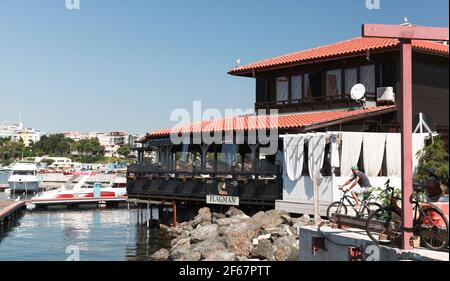 Nessebar, Bulgaria - July 21, 2014: Floating Sea food restaurant in old Nesebar, ordinary people are on the street Stock Photo