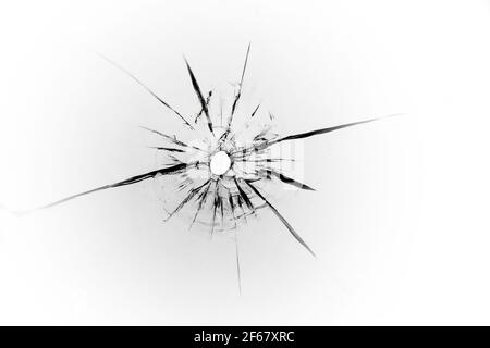 The texture of cracks from a bullet on the glass. Abstraction of shot glass for design. Stock Photo