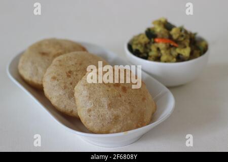 Puri and Potato masala curry. Its a deep fat fried bread made from whole wheat flour served with potato masala curry. Together known as Puri masala. S Stock Photo