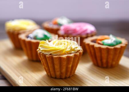 Shortbread cake with colorful creams. Cake basket. The concept of a festive treat. handmade work. cake basket Stock Photo