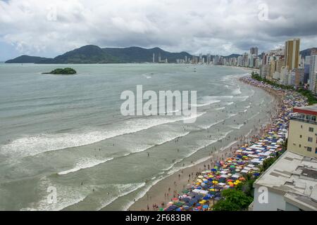 BALNEARIO CAMBORIU, BRAZIL - JANUARY 01, 2011: Packed beach full of tourists during the first day of the year Stock Photo