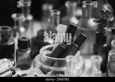 Many Old Deutsch Vintage Medical Glass Capacity. Detail Of Retro Chemical Pharmaceutical Science Researches. Small Bottles Different Sizes From Times Stock Photo