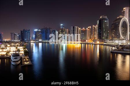 Beautiful view of the illuminated sky scrappers along with Burj khalifa captured from the Marasi drive at the Business bay district, Dubai, UAE. Stock Photo