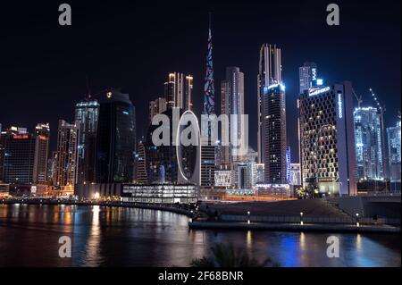 Beautiful view of the illuminated sky scrappers along with Burj khalifa captured from the Marasi drive at the Business bay district, Dubai, UAE. Stock Photo