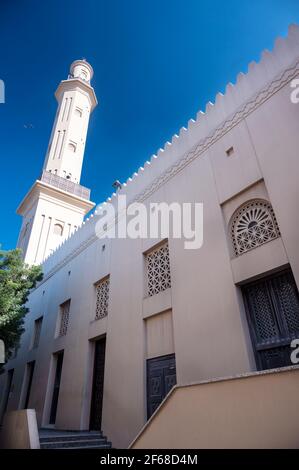View of the old Grand Mosque with beautiful minarets adnd wooden door captured at Bur Dubai, UAE. Stock Photo