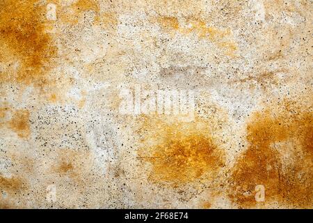 yellow weathered paint on a plastered wall Stock Photo