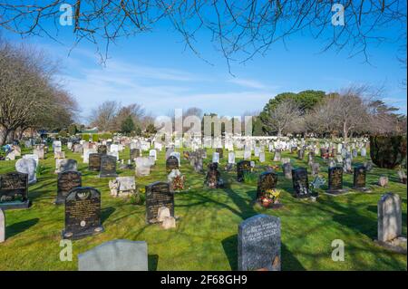 Graveyard and gravestones in a large British cemetery at Littlehampton Cemetery, Littlehampton, West Sussex, England, UK. Stock Photo