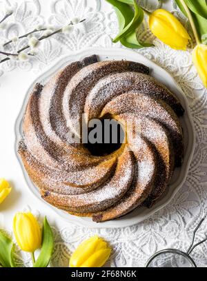 Freshly baked, traditional Polish Easter babka cake - vegan, double-layered. Stock Photo