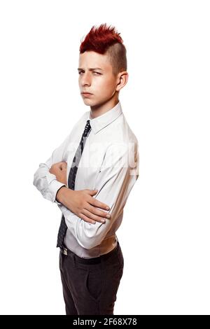 Portrait of serious teen with red mohawk wearing shirt and tie while looking at camera. Isolated. Stock Photo