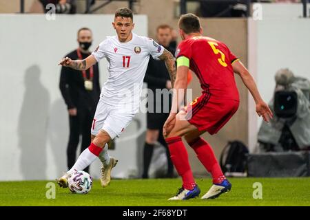 Leuven, Belgium. 30th Mar, 2021. LEUVEN, BELGIUM - MARCH 30: Vitali Lisakovich of Belarus and Jan Vertonghen of Belgium during the FIFA World Cup 2022 Qatar Qualifier match between Belgium and Belarus at Den Dreef on March 30, 2021 in Leuven, Belgium (Photo by Jeroen Meuwsen/Orange Pictures) Credit: Orange Pics BV/Alamy Live News Stock Photo