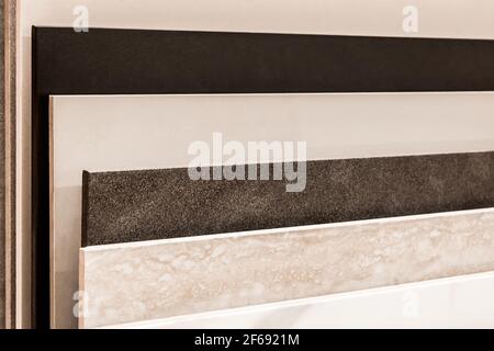 Samples of color interior design ceramic tiles in hardware store. Stock Photo