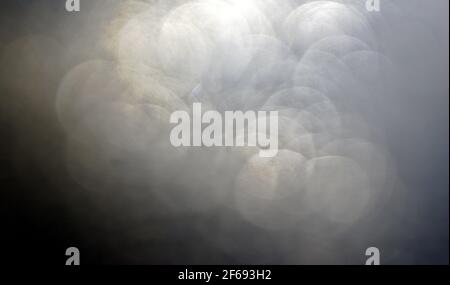 Rusty grunge circular bokeh of garden light with waterdrop abstract texture background. Stock Photo