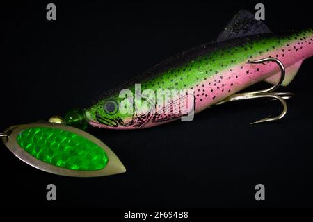 Old soft plastic fishing lure and spinner with black background Stock Photo  - Alamy