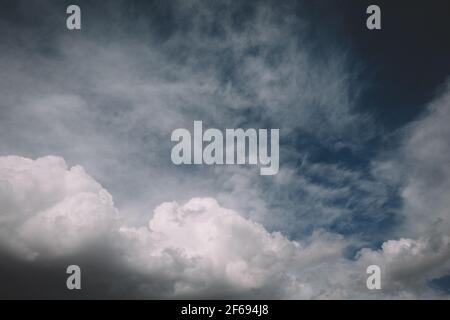 Dramatic White Puffy Clouds against a Blue Sky Stock Photo