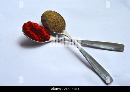 spices in spoons on white background Stock Photo