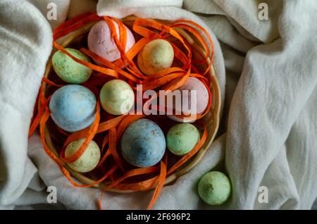 Easter eggs in a basket, top view Stock Photo