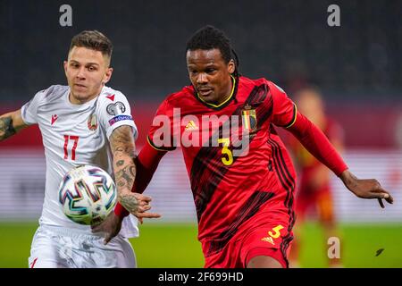 LEUVEN, BELGIUM - MARCH 30: Dedryck Boyata of Belgium and Vitali Lisakovich of Belarus during the FIFA World Cup 2022 Qatar Qualifier match between Be Stock Photo