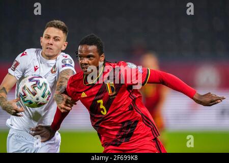 LEUVEN, BELGIUM - MARCH 30: Dedryck Boyata of Belgium and Vitali Lisakovich of Belarus during the FIFA World Cup 2022 Qatar Qualifier match between Be Stock Photo