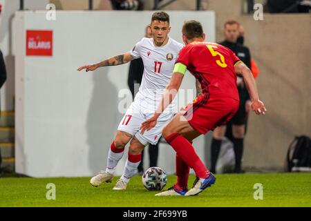 LEUVEN, BELGIUM - MARCH 30: Vitali Lisakovich of Belarus and Jan Vertonghen of Belgium during the FIFA World Cup 2022 Qatar Qualifier match between Be Stock Photo