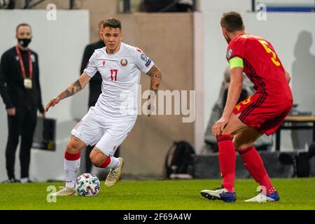 LEUVEN, BELGIUM - MARCH 30: Vitali Lisakovich of Belarus and Jan Vertonghen of Belgium during the FIFA World Cup 2022 Qatar Qualifier match between Be Stock Photo