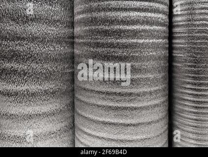 Silver rolls of insulation material, building materials in a hardware store. Stock Photo