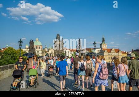 tourist crowds on Charles Bridge, a landmark stone bridge linking Prague's Old & New Towns, Capital City of Prague, Czech Republic Stock Photo