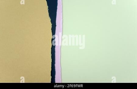 Shredded papers abstract texture background. Brown, dark blue, purple, and pastel green color parchment. Empty matte combined papers. Copy space. Stock Photo