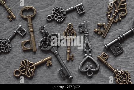 Retro keys collection on old wooden background Stock Photo