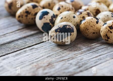 Quail eggs on old wooden table Stock Photo