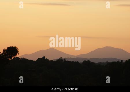 Landscape in Bedford County, VA, USA. Silhouettes of the Blue Ridge Mountains, with the Sharp Top on the left. Stock Photo