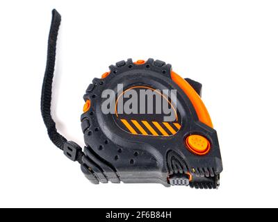 Worker measuring tape tool on white background. Yardstick. Craftsman equipment. Builders hand tool. Centimeter and inch. Flexible meter. Length meter. Stock Photo