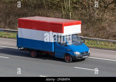 2005 05 plate red white blue Mercedes Benz Sprinter 311 Cdi Mwb box van, 2148cc Luton LCV. Vehicular traffic, moving vehicles, vehicle driving on UK roads, motors, motoring on the M6 highway English motorway road network Stock Photo