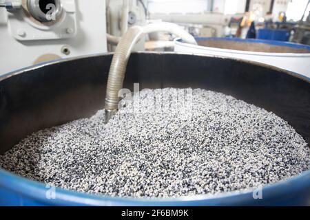 Open barrel full grain malt. White polypropylene bag. PP Stock Photo