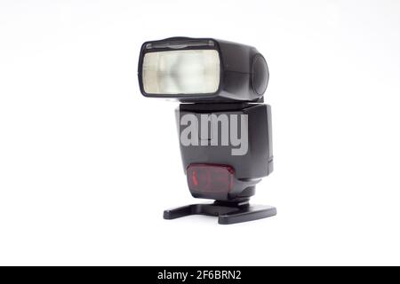 Digital external flash for camera isolated on white background. Stock Photo