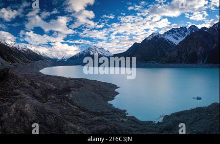 Panoramic view of mountain ridge covered with snow over Tasman Lake. Aerial view of New Zealand fantastic landscapes and scenery. Stock Photo